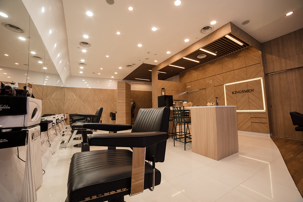Barber chairs arranged around the central feature at Kingsmen